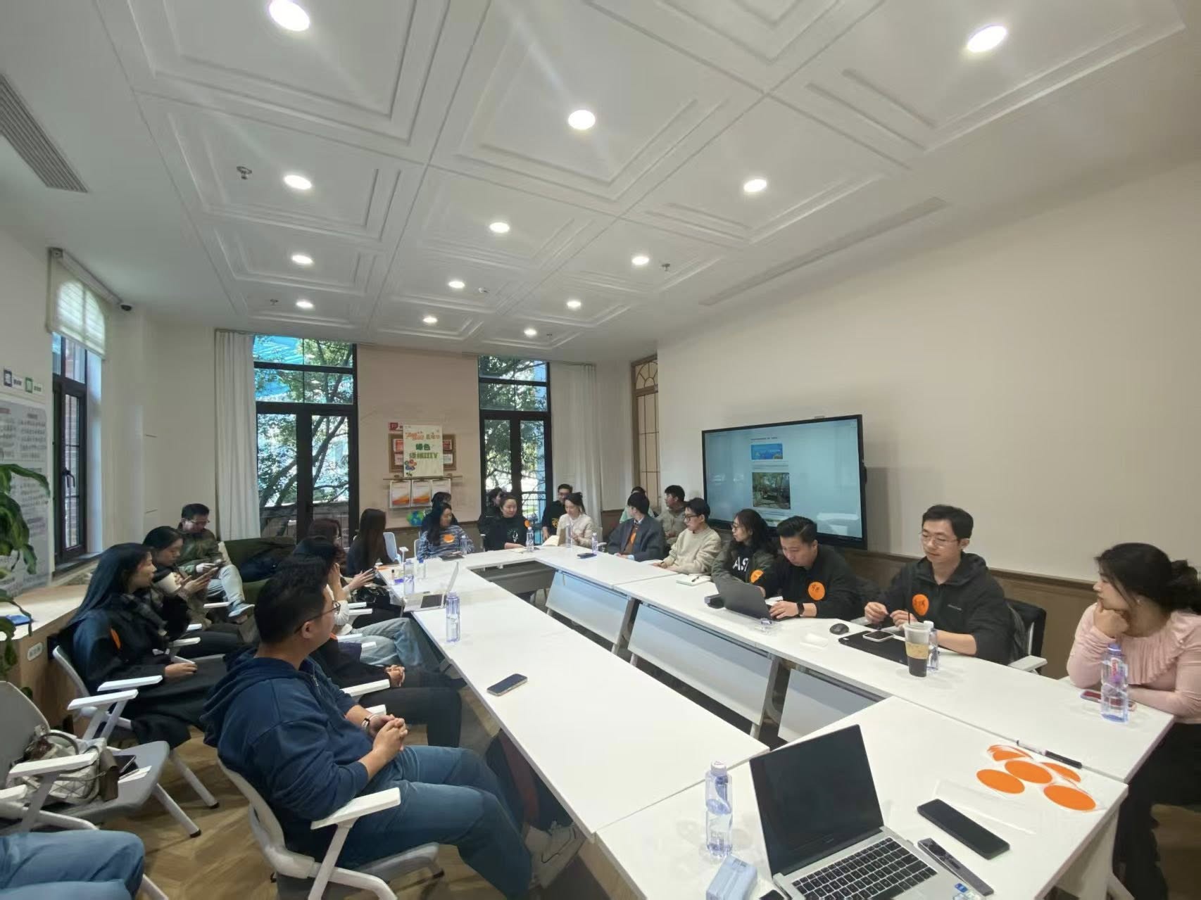 An ECom Coffee Chat — people gathered around a table, exchanging ideas