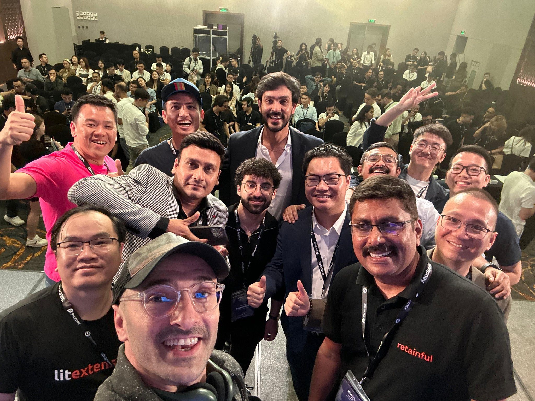 International speakers and the ShopX 2025 host team on stage