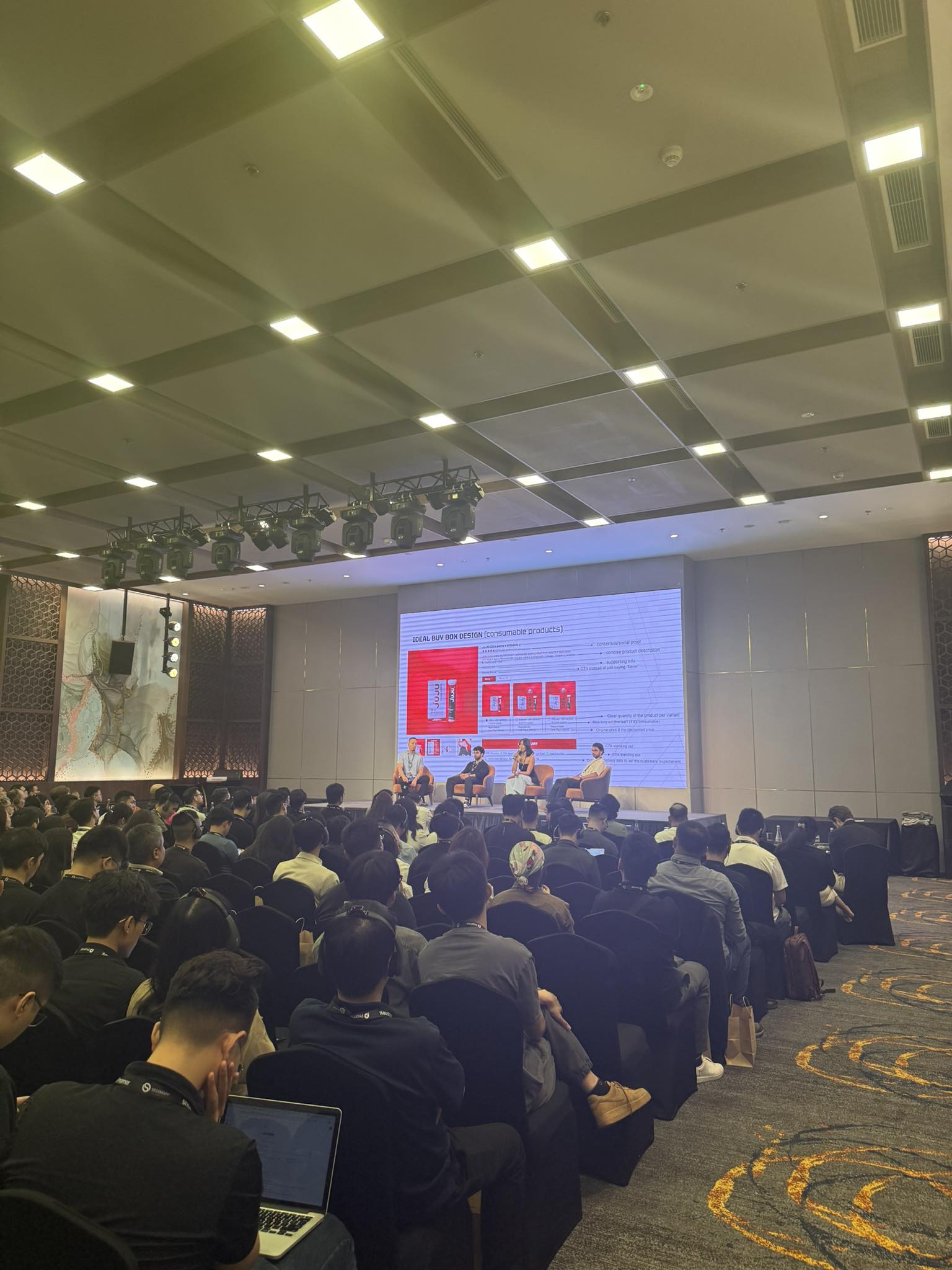 Packed ballroom watching a panel discussion at ShopX 2025
