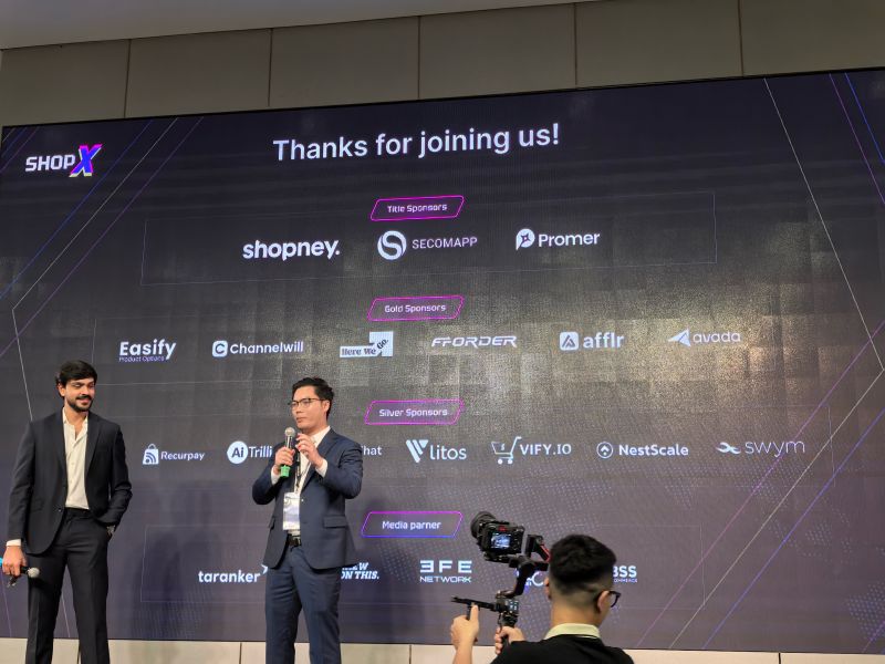 Speakers and sponsors on the ShopX 2025 stage